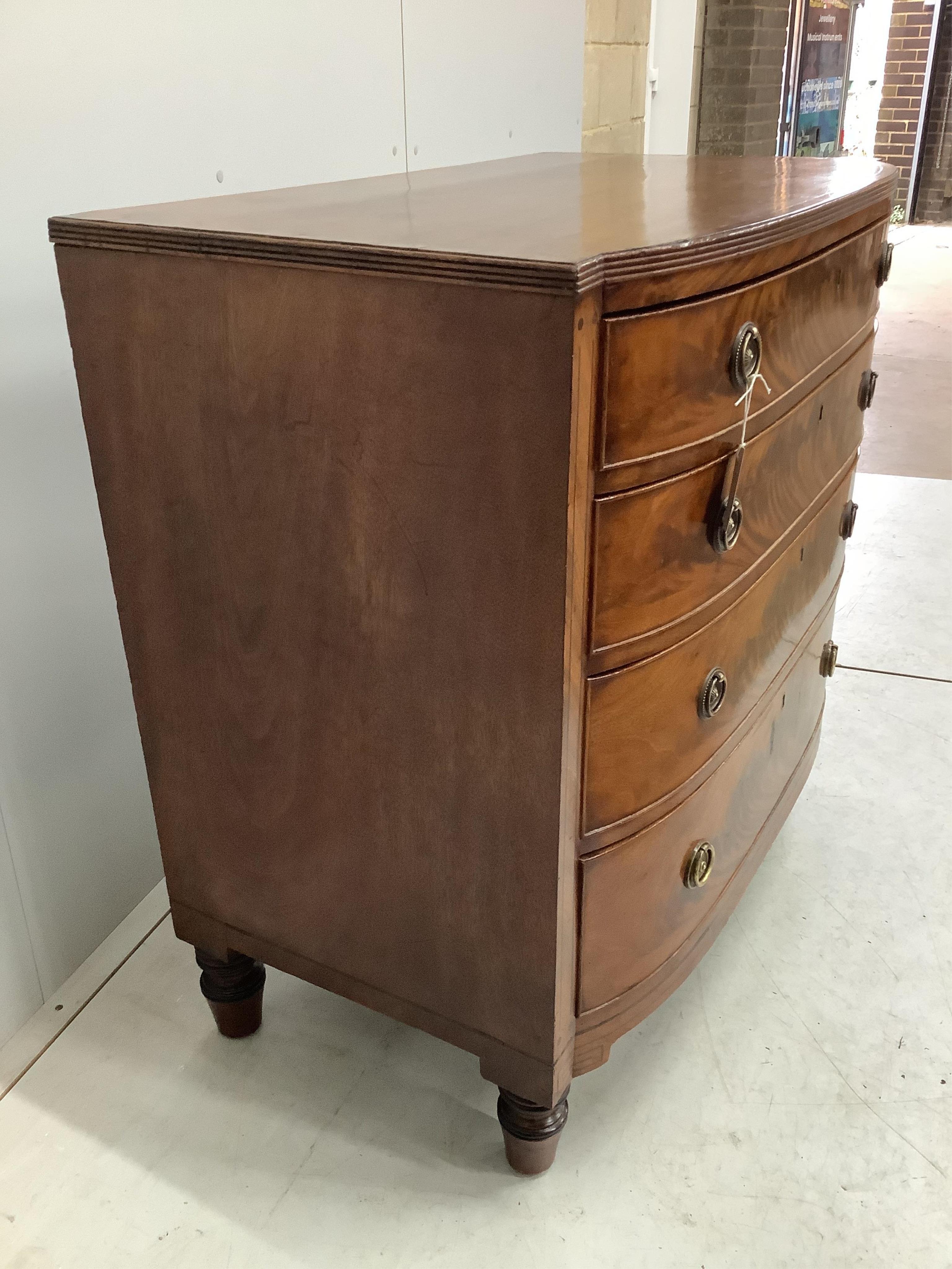 A Regency rosewood banded mahogany bow front chest, width 92cm, depth 54cm, height 91cm. Condition - fair